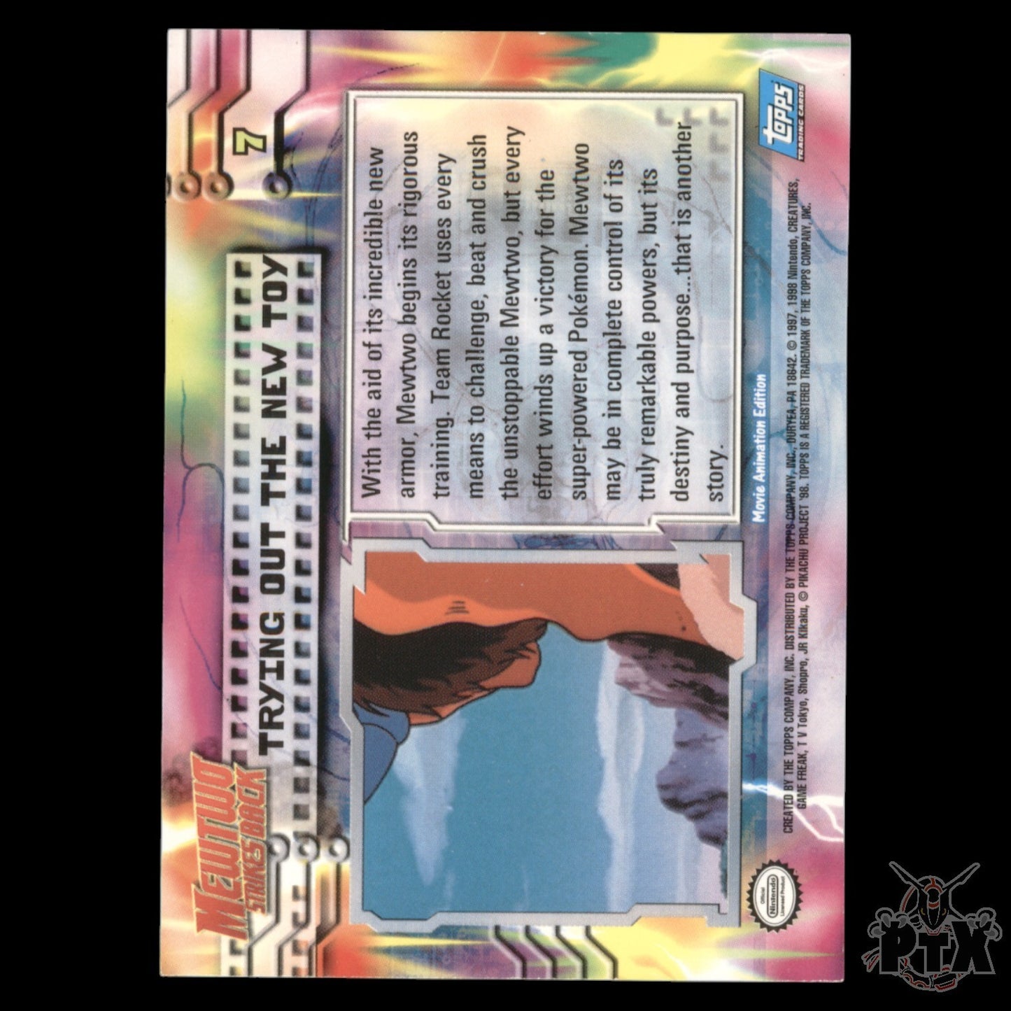 Topps The First Movie Trying out the new toy Foil Mewtwo Strike Back Pokemon